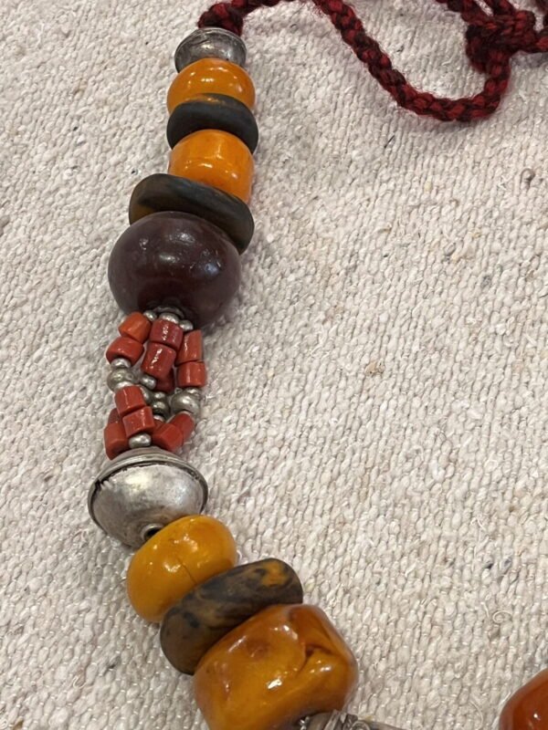 This Moroccan amber necklace is made of amber, coral, silver