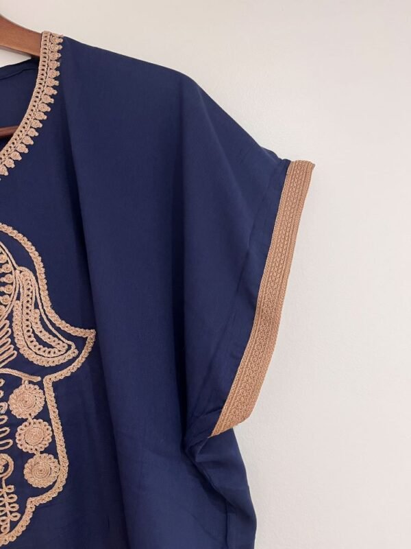 blue kaftan with hamsa design