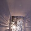 pierced sconce light allows beautiful patterns