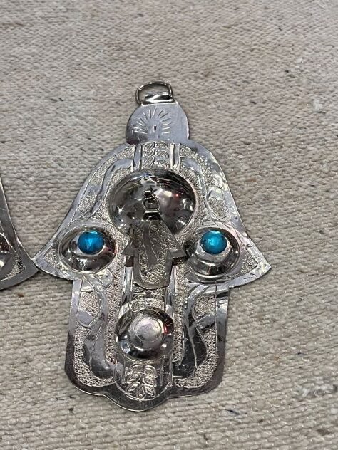 hang silver hamsa in home and business as a protective talisman