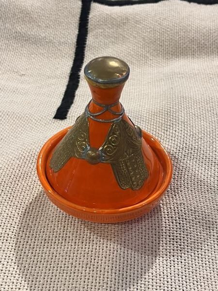 serving small tagine with hamsa decor