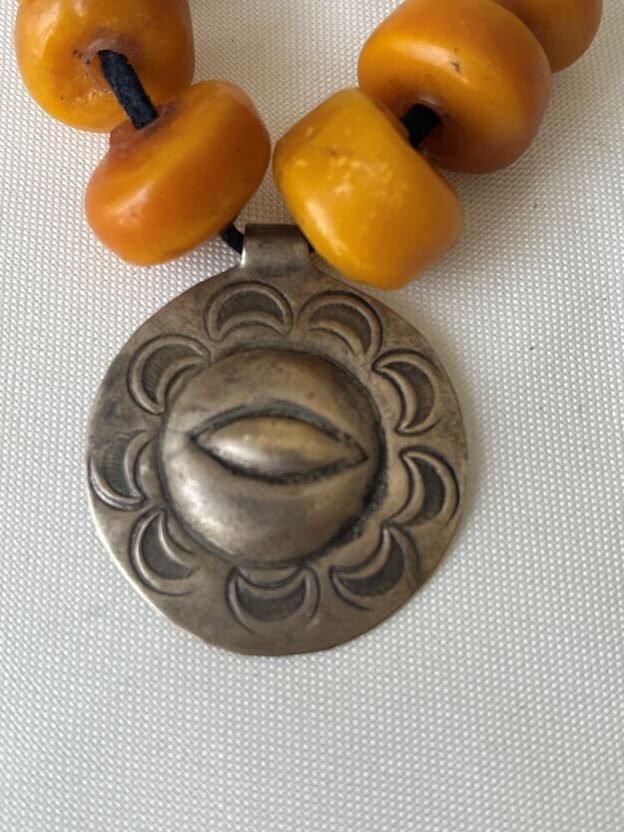eye in medallion center pendant