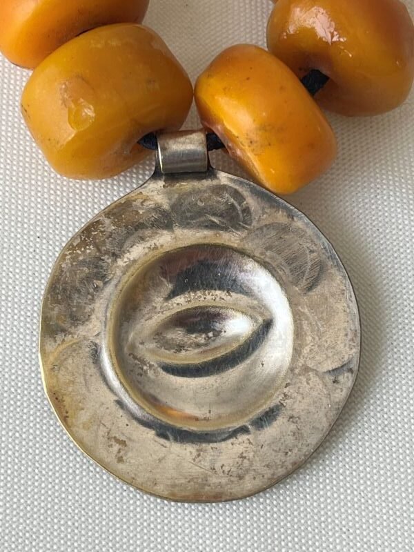 back of brass medallion of antique berber necklace