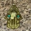 main-khamsa- protection-pierre-verte brass wall hanging hamsa with green stones
