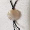 Pendentif rond poli en agate