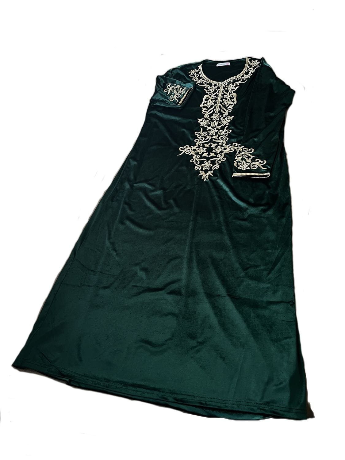 Moroccan kaftan combines the rich look of bleu velvet with elaborate gold-tone embroidery
