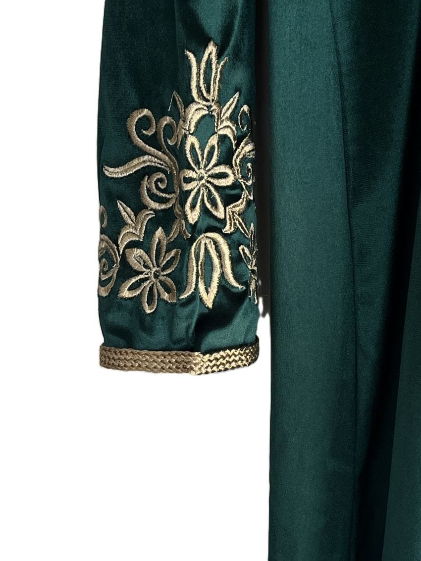 sleeves have small openings at the cuffs, adding a distinctive detail to the design